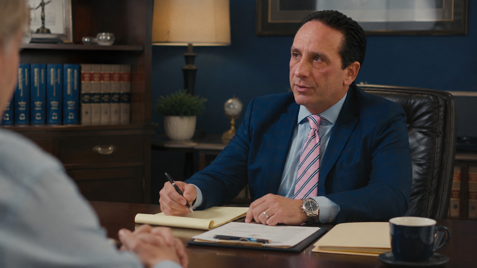 Attorney reviewing a workplace injury claim with an injured worker